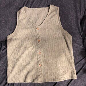 Green matching tank-top and shorts.